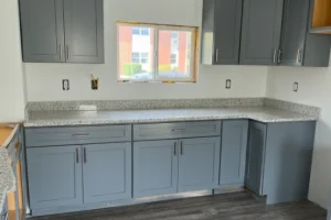 A kitchen with modern gray cabinets and updated countertops in Lewisburg, PA