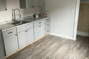 A kitchen with modern gray cabinets and updated countertops
